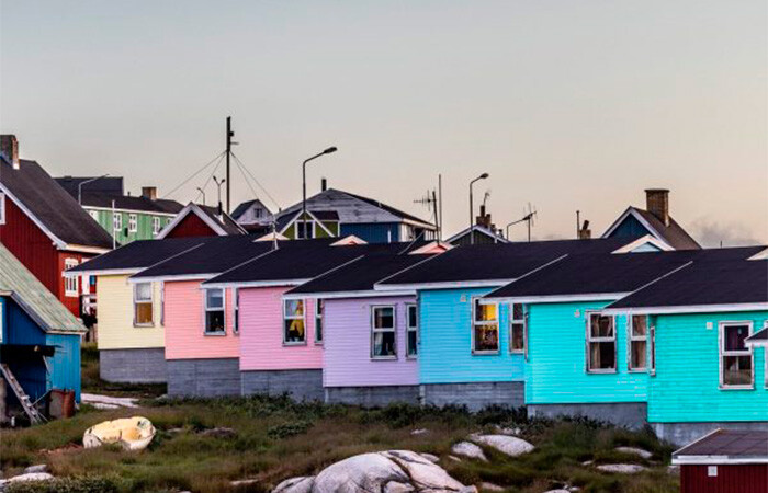 Beautiful view of colorful houses with sunset in the background.