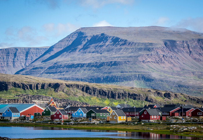 Beautiful view of the city with colorful houses by the ocean.